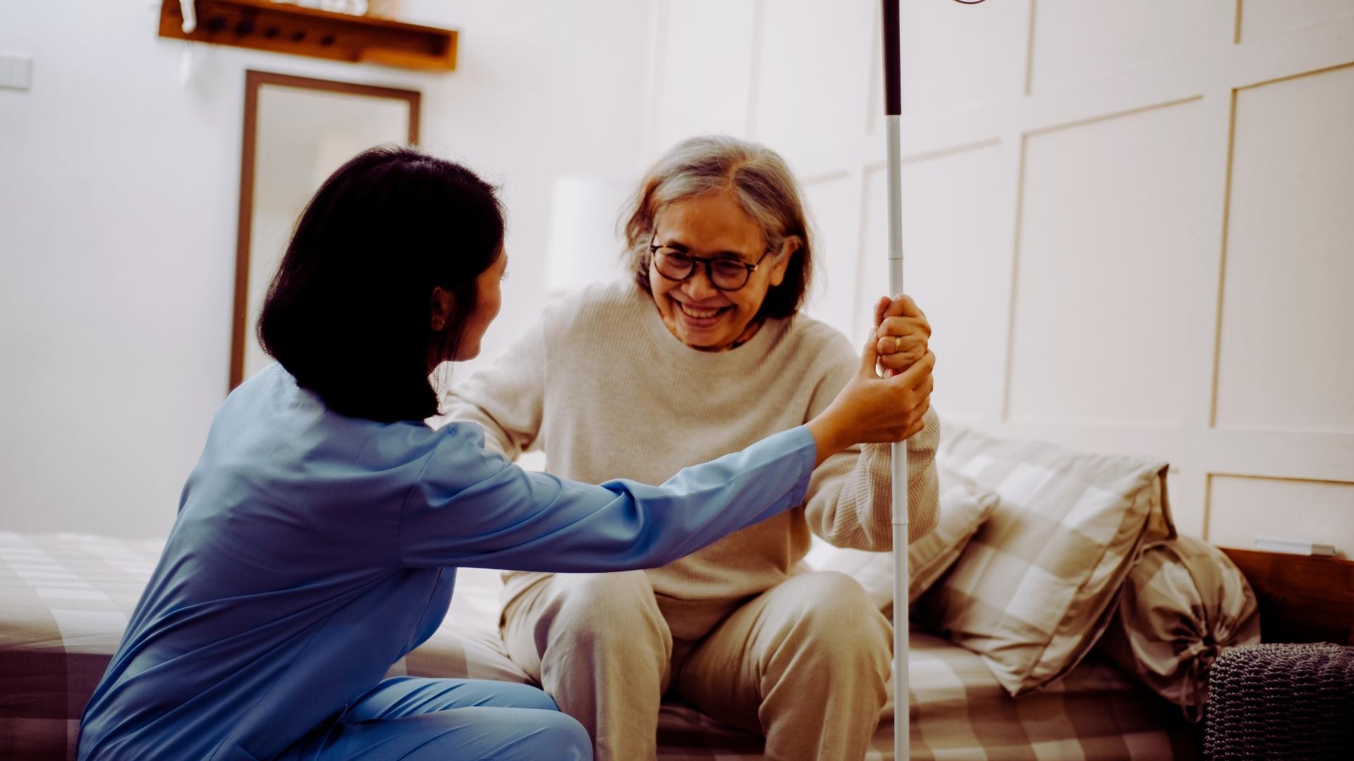 Caregiver helping elder patient